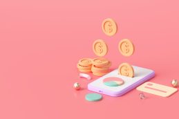 Uma ilustração gráfica celular colocado em cima de uma mesa, com moedas saindo do celular e representando o Digital Finance